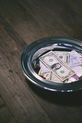 should you tithe while paying off debt