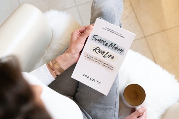 Woman reading Simple money rich life book